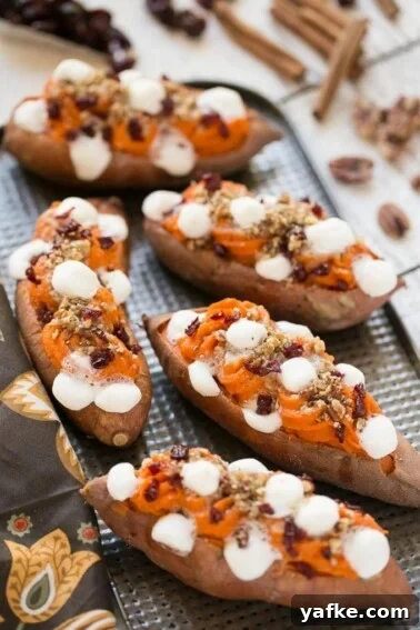 Loaded twice baked sweet potatoes topped with streusel and marshmallows.