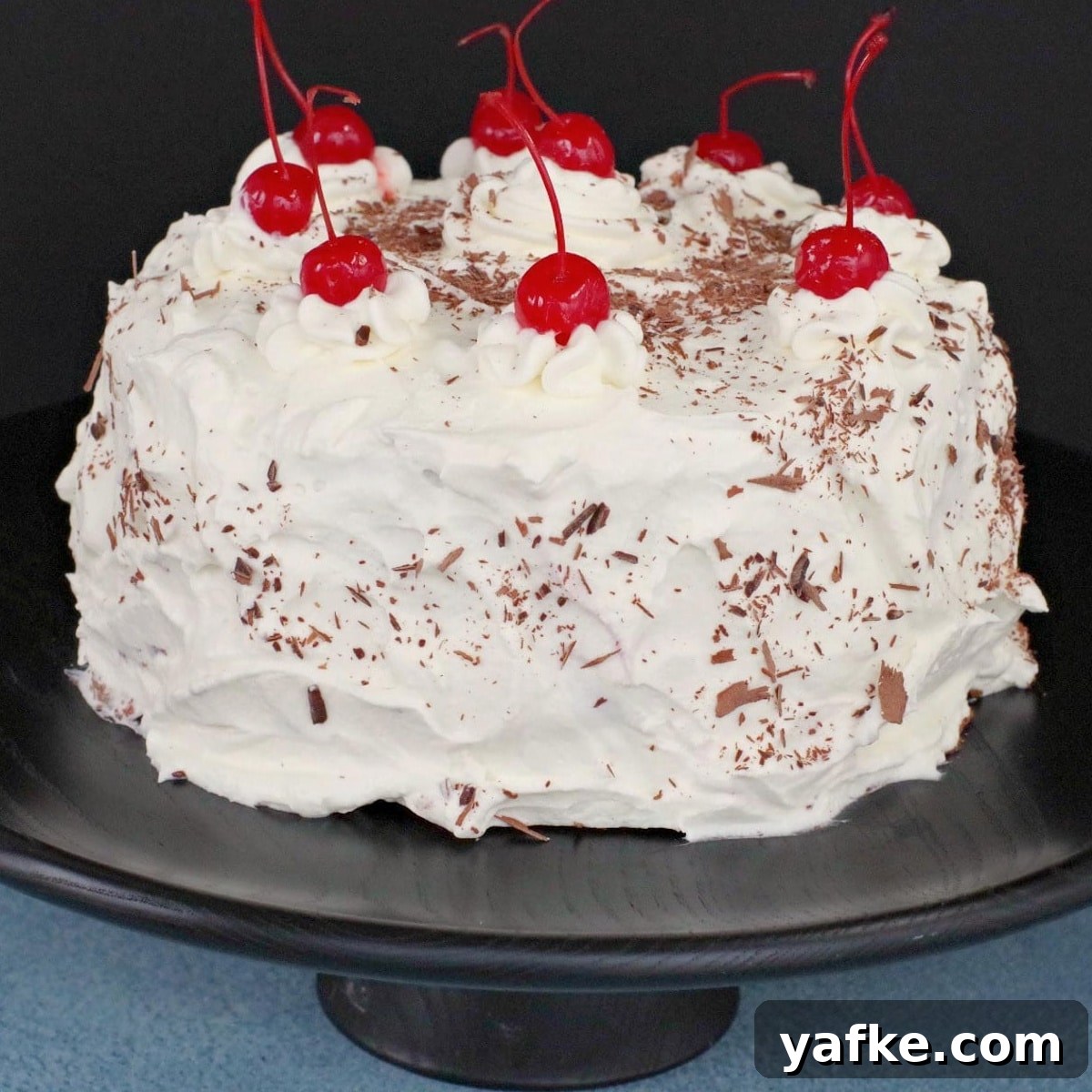 21 Patriotic Canada Day Desserts 18 whole black forest cake on black cake stand