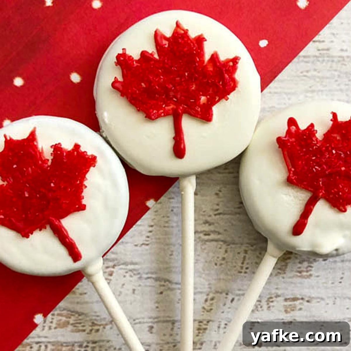 21 Patriotic Canada Day Desserts 5 3 Canada Day Oreo pops on a red and white background