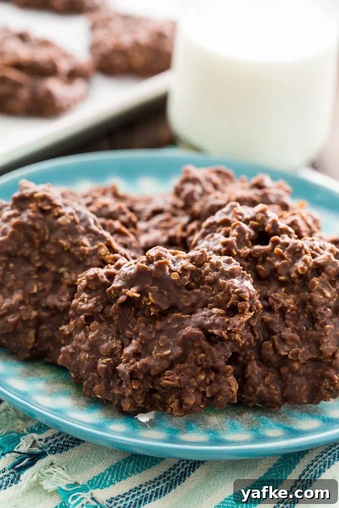Chewy No-Bake Chocolate Oatmeal Cookies 8 Chocolate Oatmeal Cookies on plate.