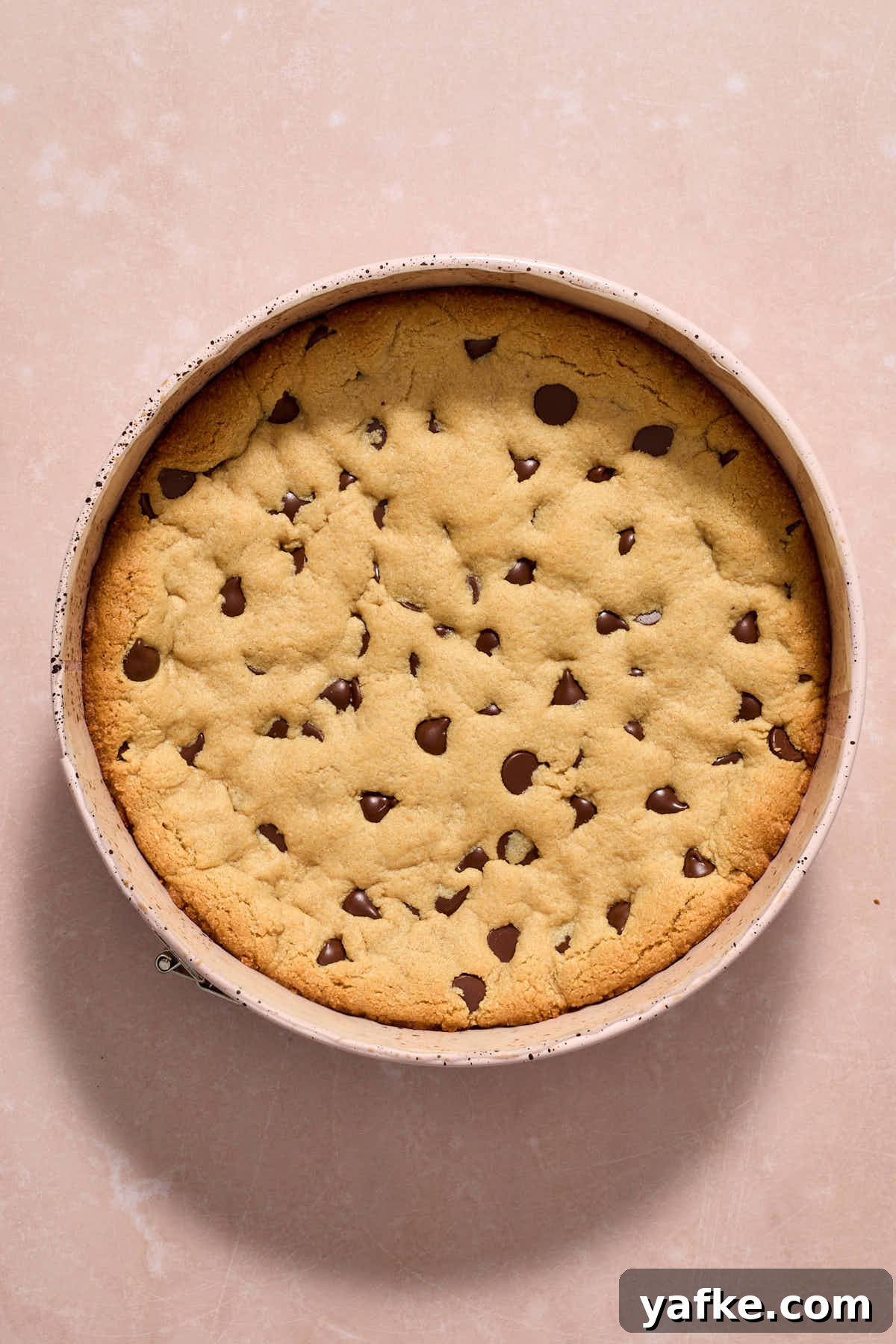 Almond Flour Cookie Cake with Peanut Butter and Chocolate Chips 11 Cookie cake baked and cooling in pan.