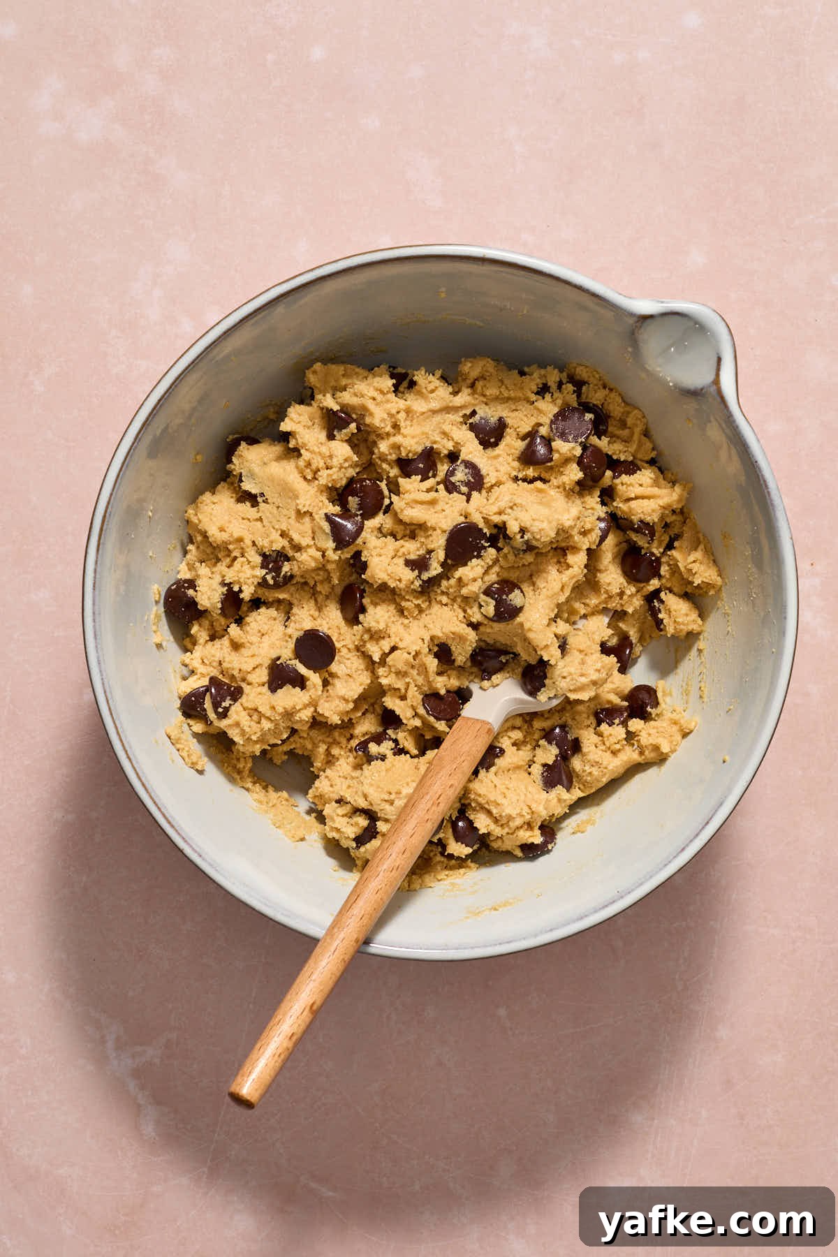 Almond Flour Cookie Cake with Peanut Butter and Chocolate Chips 9 Chocolate chips folded into the batter with a spatula.