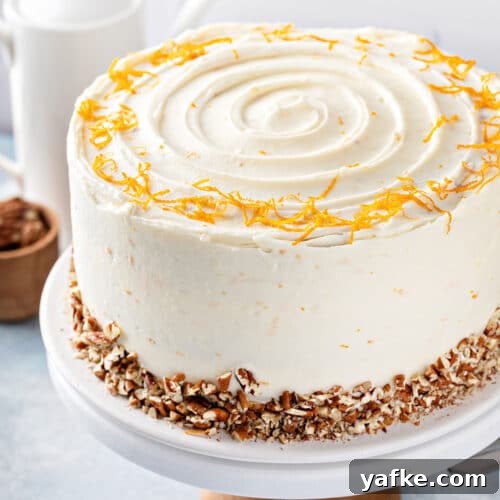 Carrot Cake Recipe with Grand Marnier Cream Cheese Frosting 15 Cream cheese frosted carrot cake decorated with chopped pecans and orange zest