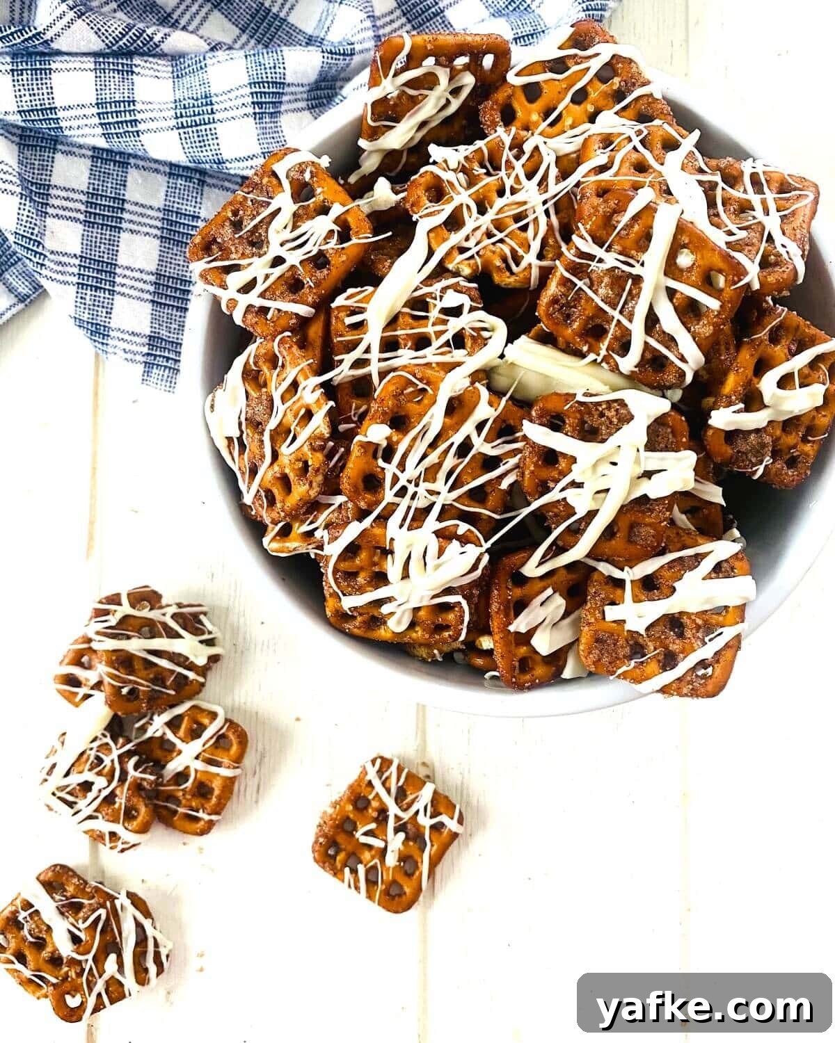 Pumpkin Spice Pretzels Drizzled with White Chocolate 11 salty sweet fall snack in a bowl.