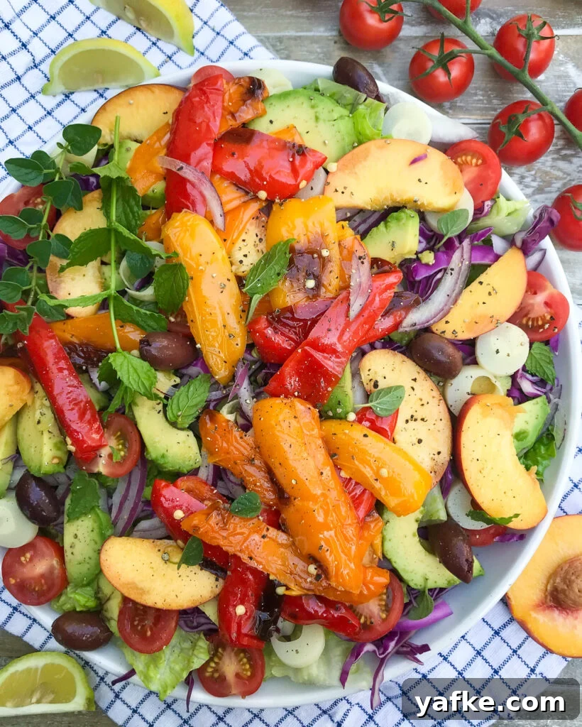 Fresh Mediterranean Avocado and Peach Salad with Peppers 2 summery Mediterranean Salad with avocados, peaches, hearts of palm, red onions, cherry tomatoes, olives, and more.