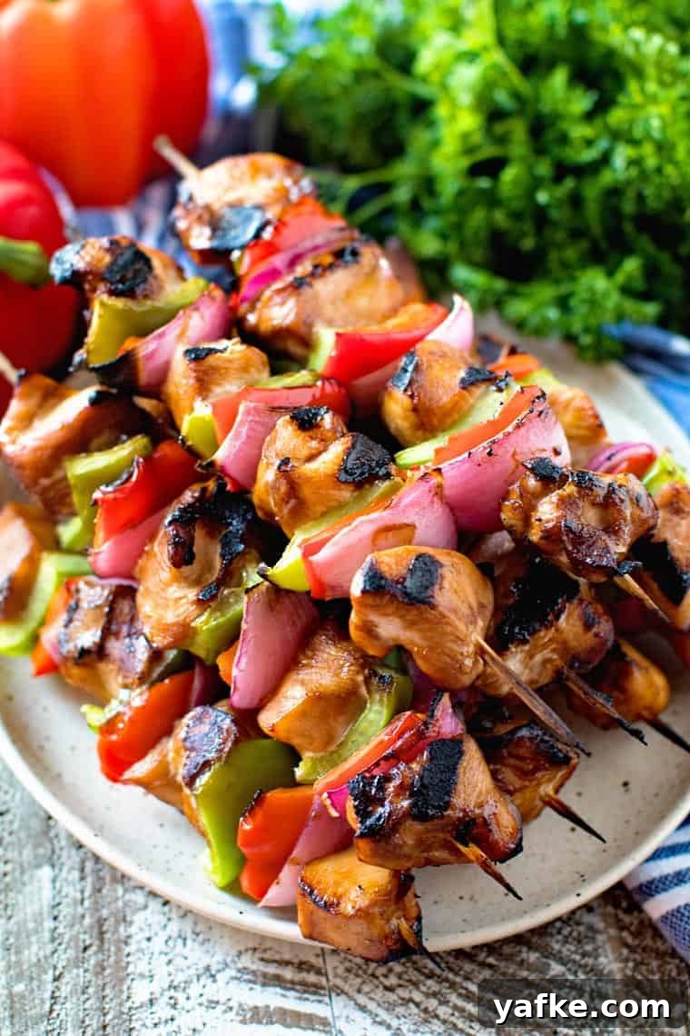 Grilled Asian Chicken Skewers with Sesame and Ginger 3 Asian Chicken Skewers on plate