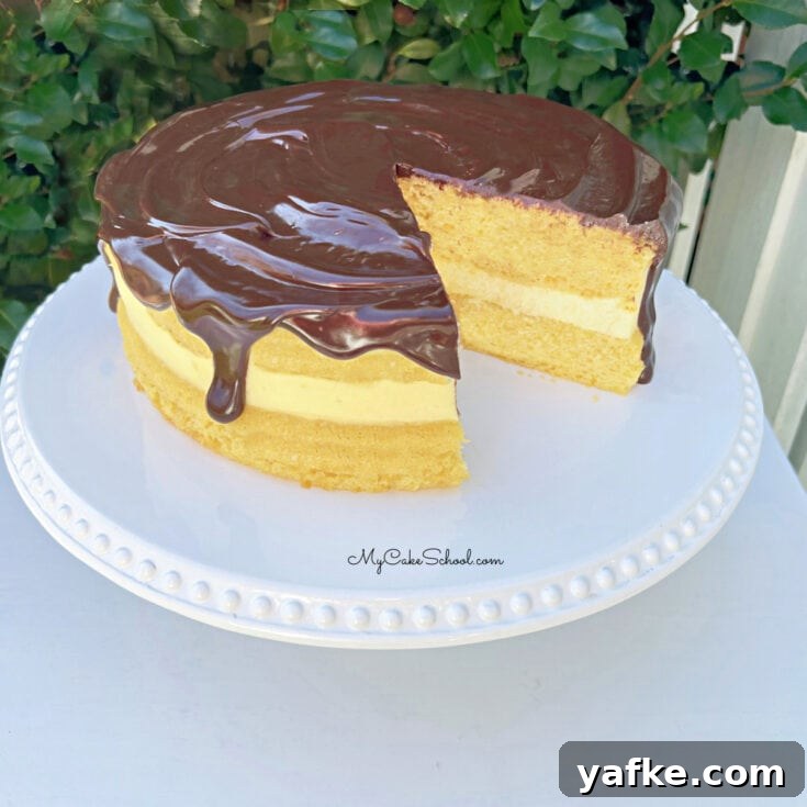 Boston Cream Pie from Cake Mix on a white pedestal
