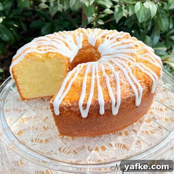 Million Dollar Pound Cake, sliced, on a cake plate.