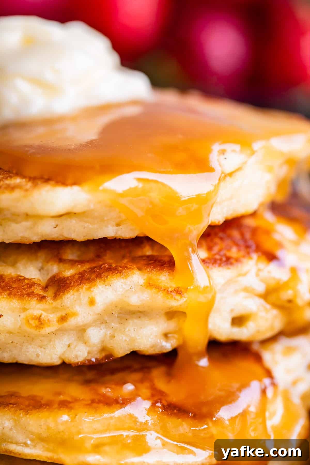 Homemade Buttermilk Syrup for Pancakes and Waffles 13 homemade buttermilk syrup drizzled over pancakes with butter.