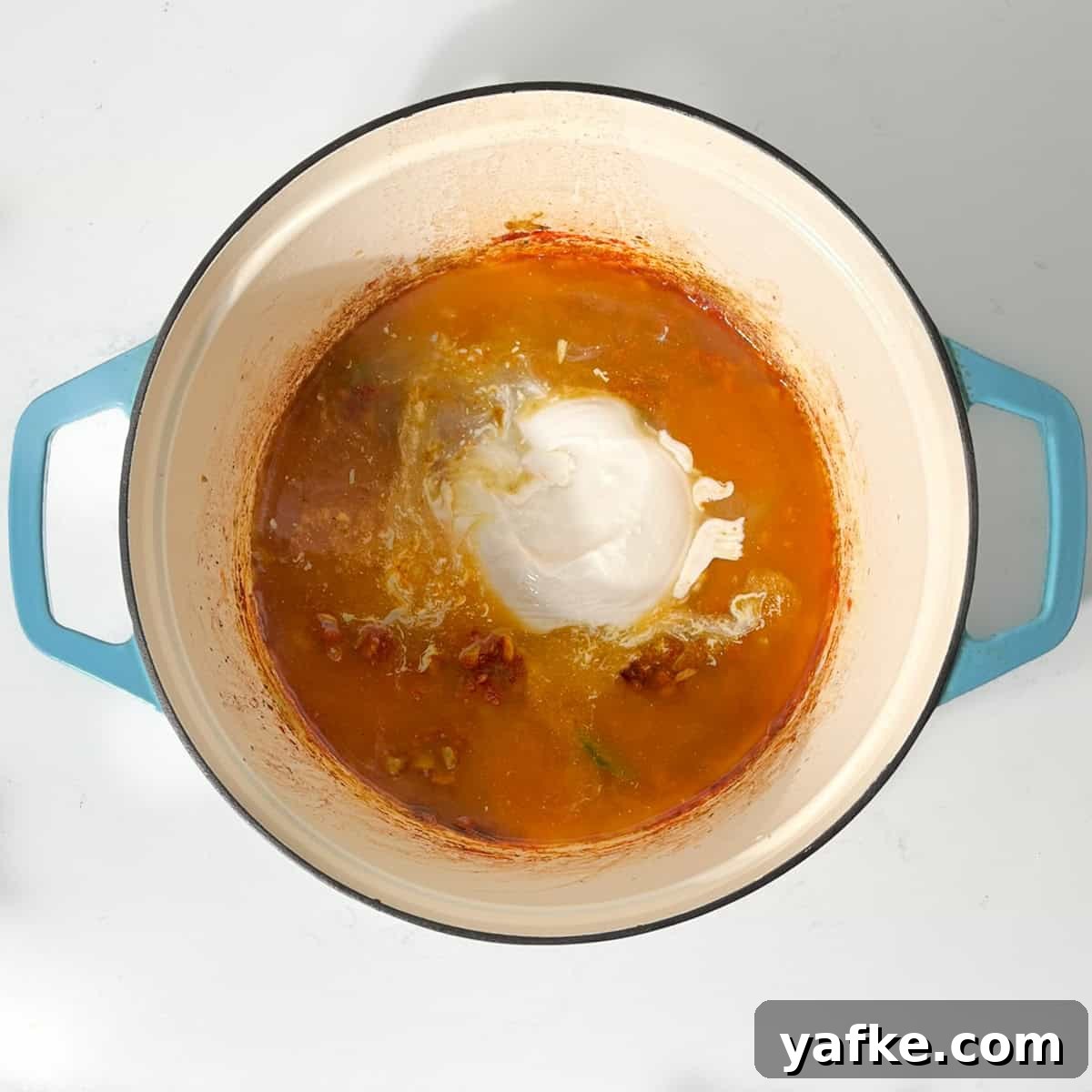 Creamy Beef Curry with Coconut Milk Recipe 10 Adding coconut milk to the large saucepan.