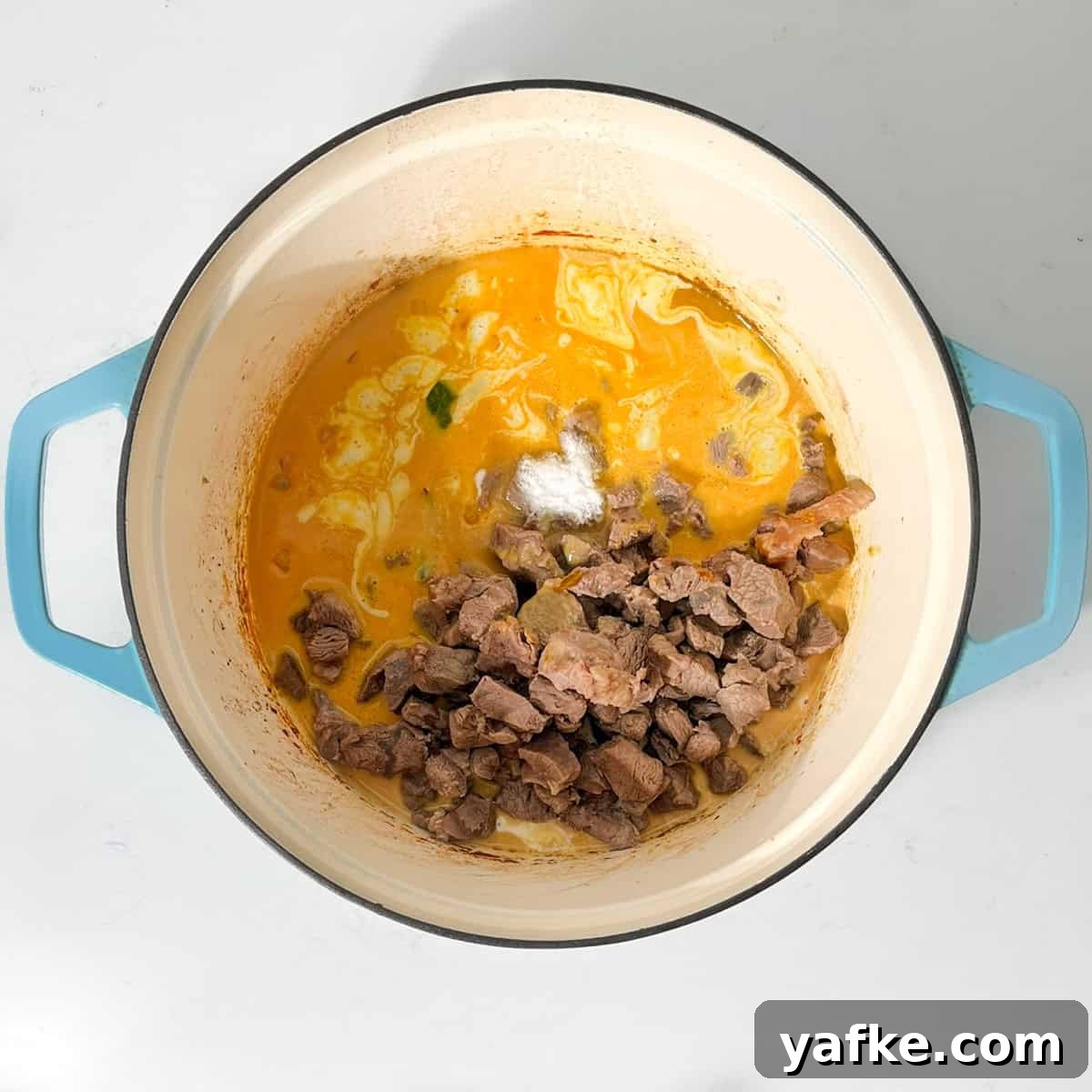 Creamy Beef Curry with Coconut Milk Recipe 11 Adding the beef back into the pot for the beef curry with coconut milk.