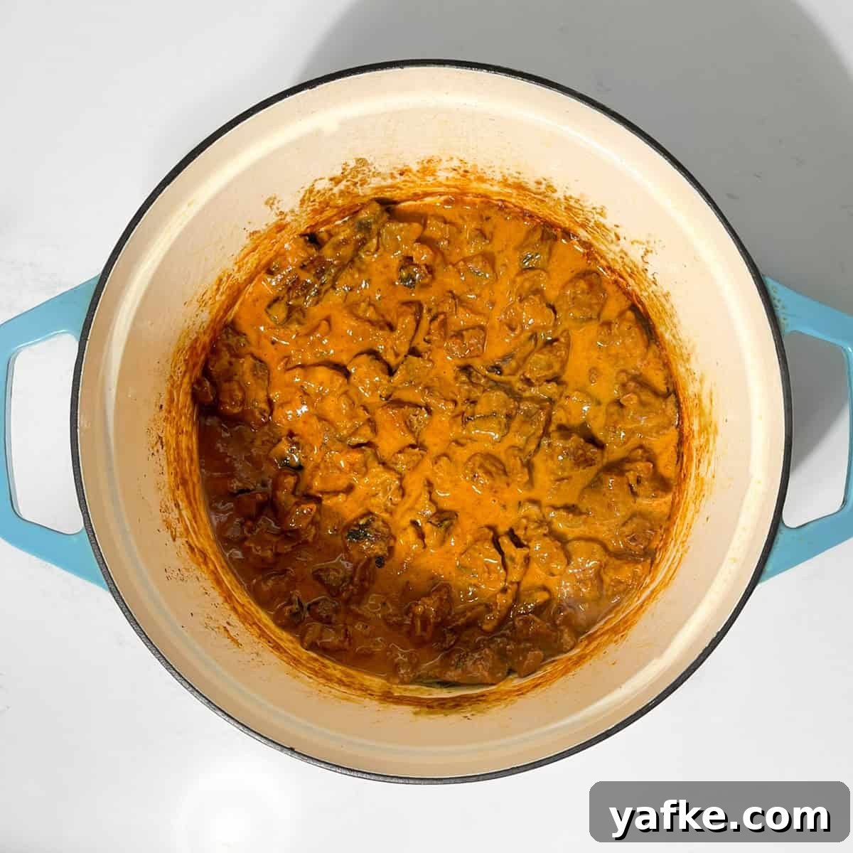 Creamy Beef Curry with Coconut Milk Recipe 13 Completed beef curry with coconut milk in a large saucepan.