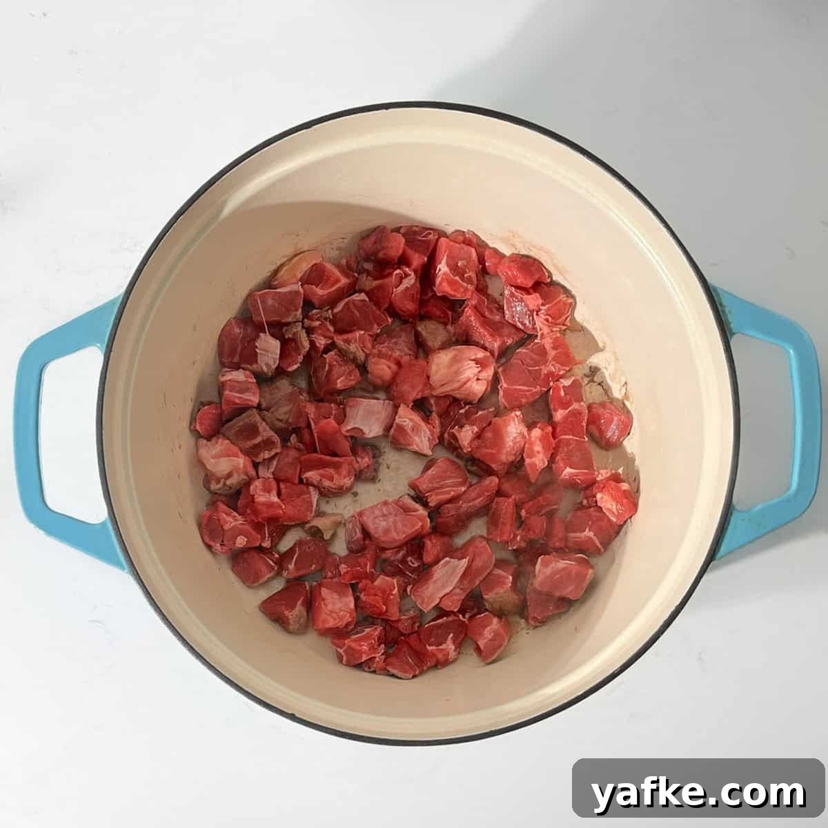 Creamy Beef Curry with Coconut Milk Recipe 5 Browning the meat for the beef curry in a large saucepan.