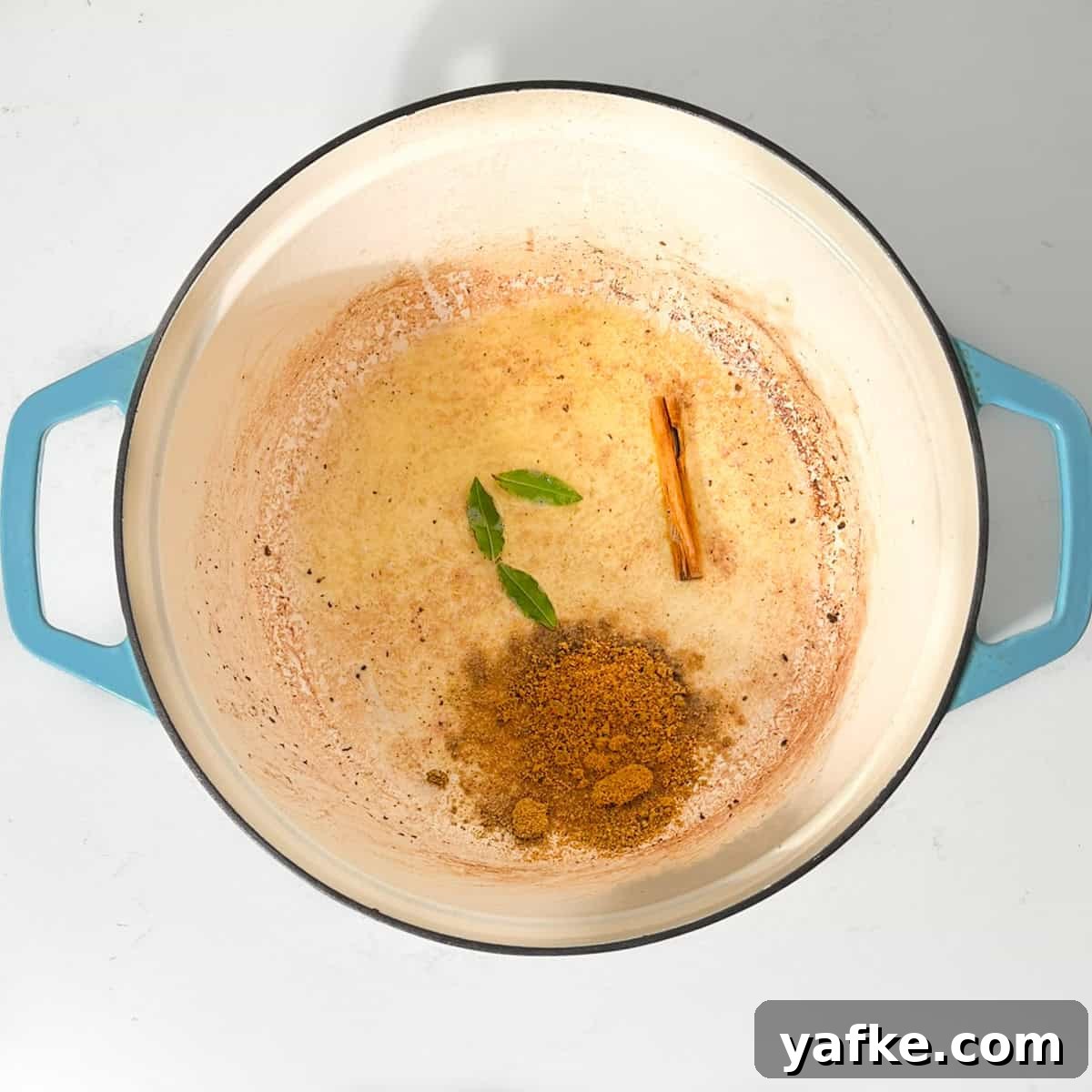 Creamy Beef Curry with Coconut Milk Recipe 6 Adding the bay leaves and curry powder to the butter in a large saucepan.