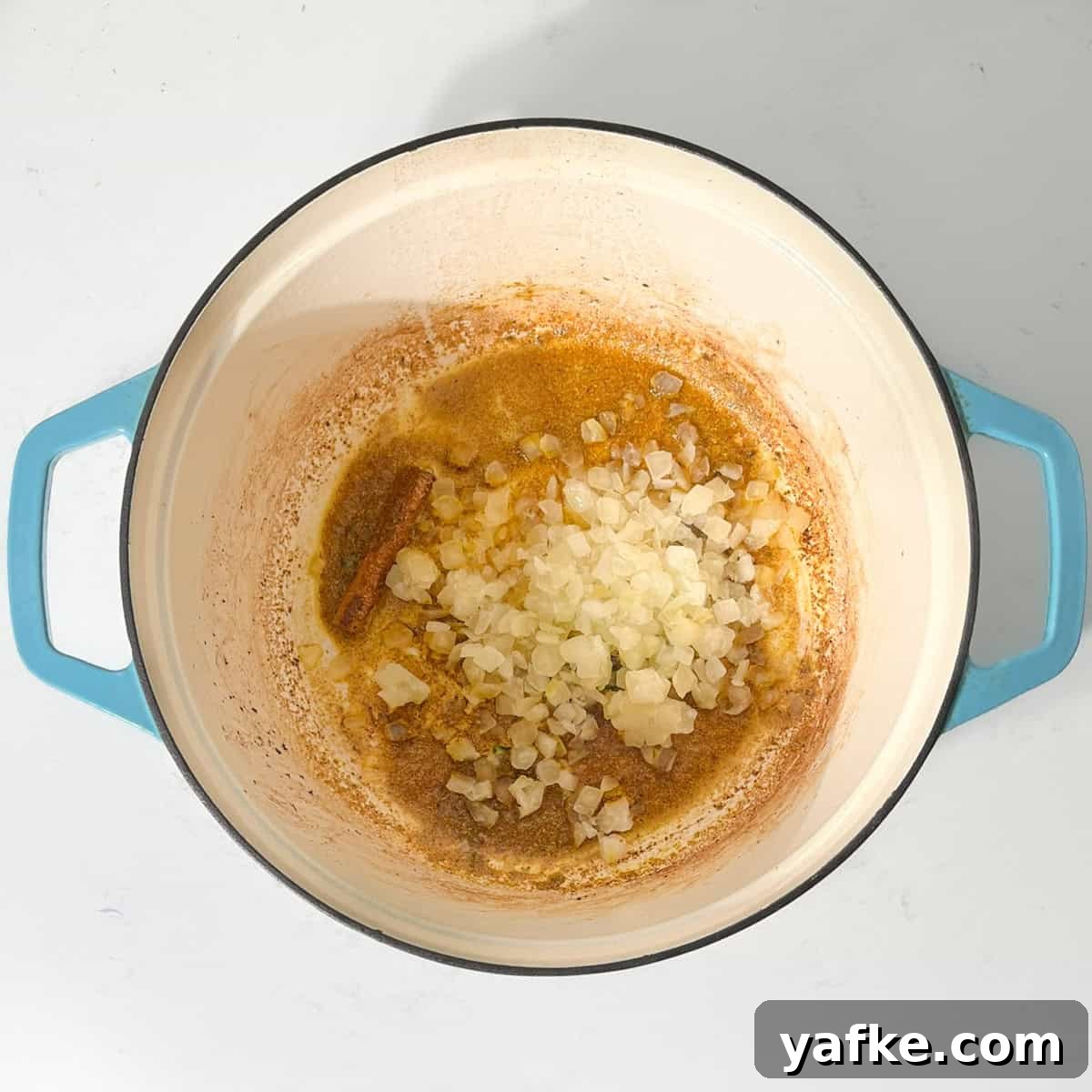 Creamy Beef Curry with Coconut Milk Recipe 7 Adding onions to the hot oil for the beef curry with coconut milk.