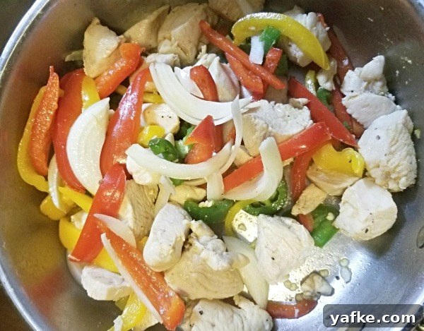 One-Pan Chicken Fajita Pasta Recipe 3 Chicken and peppers in skillet