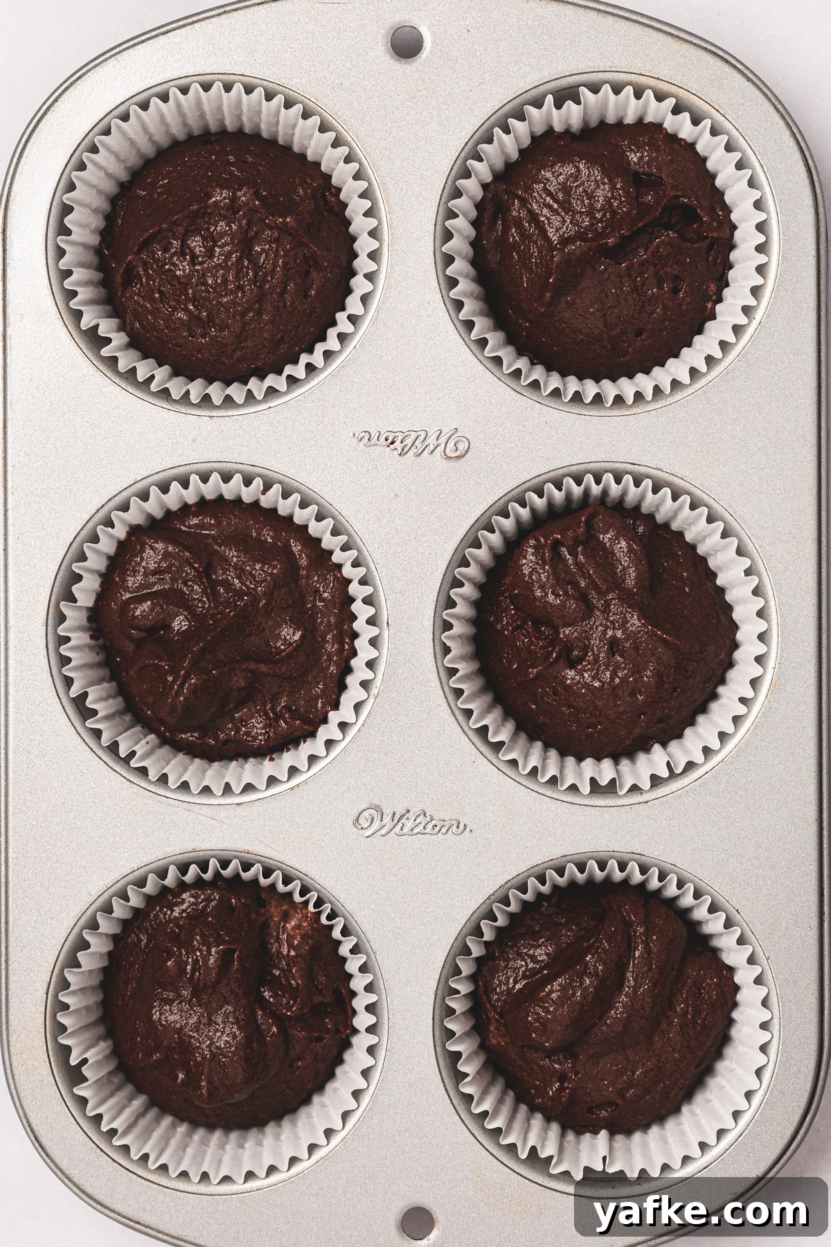 Small-Batch Chocolate Cupcake Recipe 6 6 chocolate cupcakes before baking in a cupcake pan