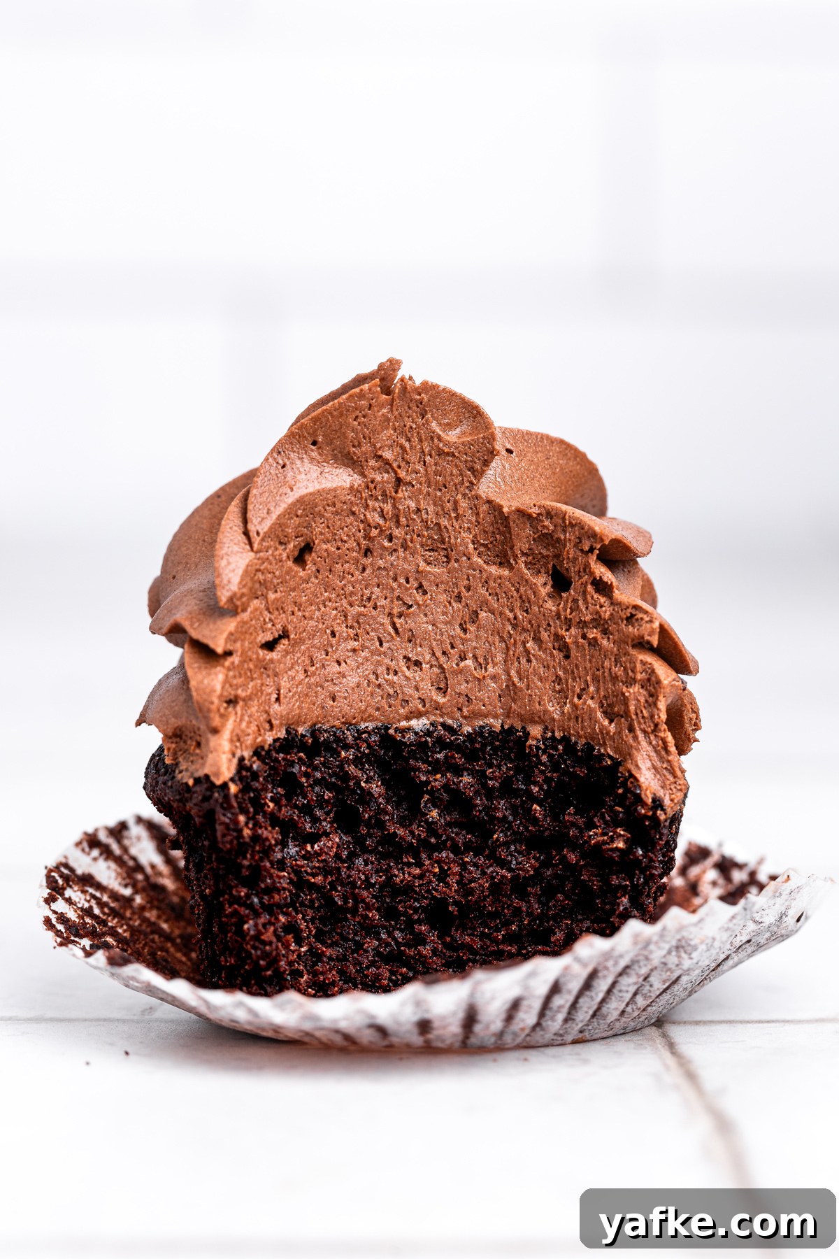 Small-Batch Chocolate Cupcake Recipe 8 small batch chocolate cupcake cut in half with chocolate frosting