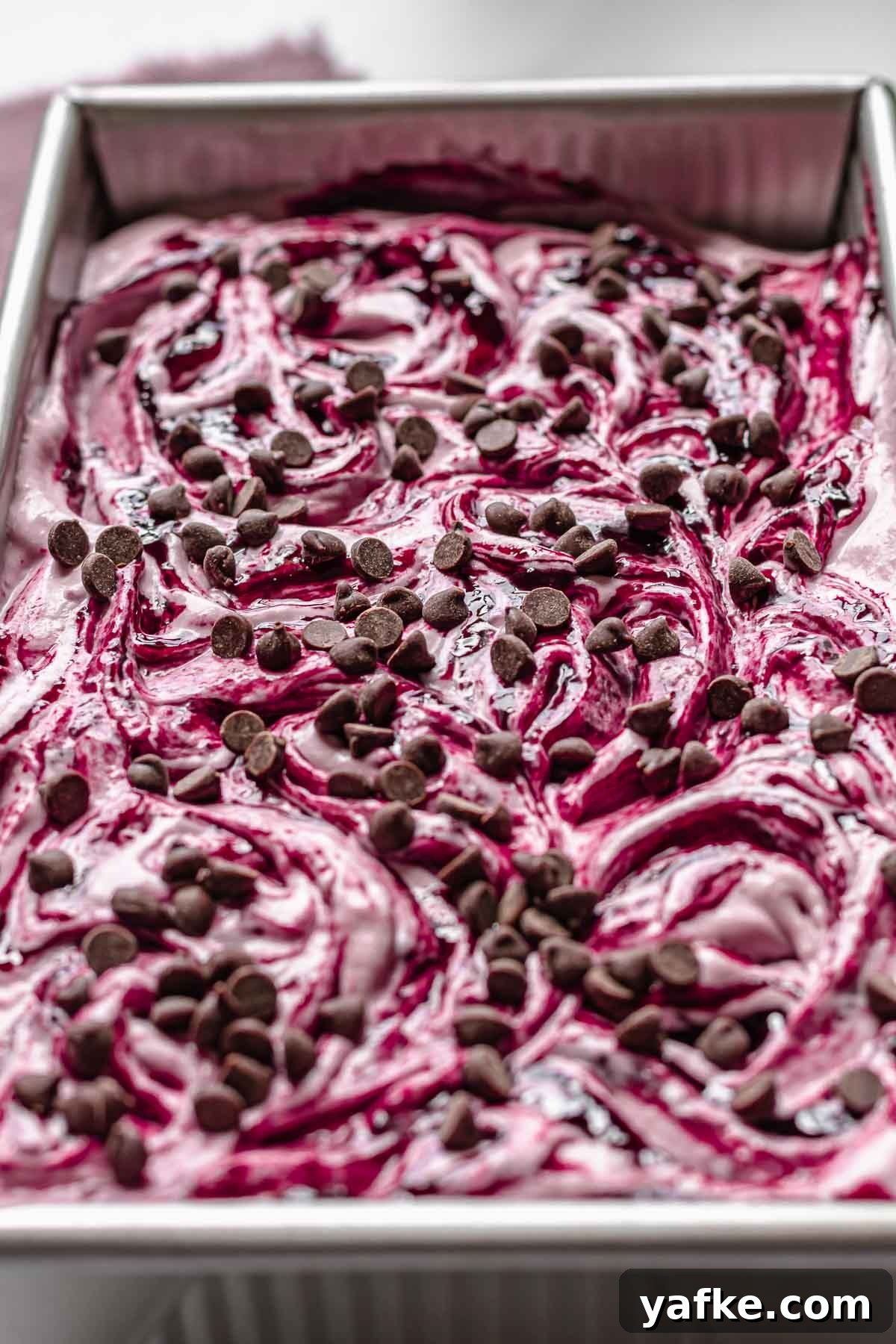 Creamy No-Churn Blackberry Chocolate Chip Ice Cream Recipe 12 Chocolate chips on top of the swirled and finished ice cream.