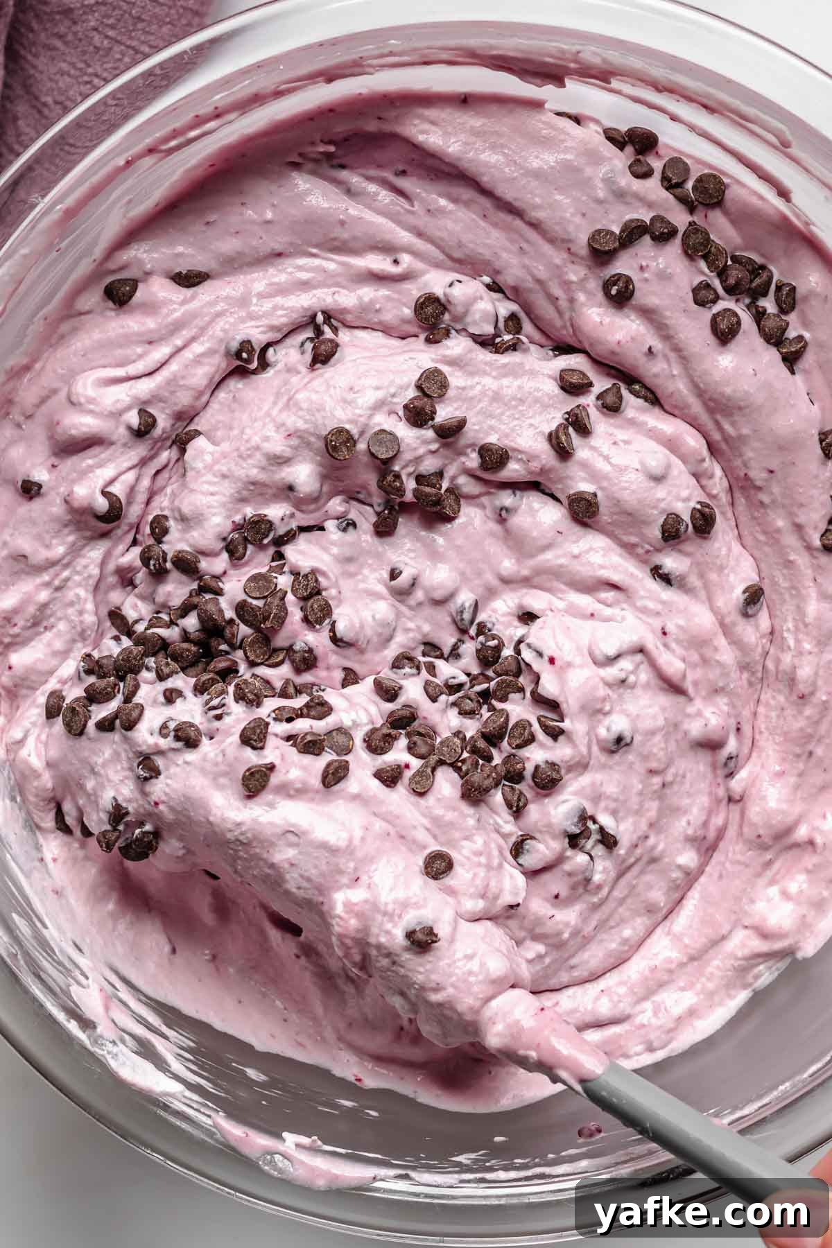 Creamy No-Churn Blackberry Chocolate Chip Ice Cream Recipe 10 Folding mini chocolate chips into the ice cream base.