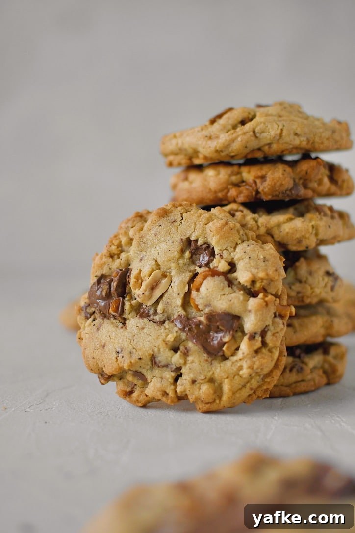 Kitchen Sink Cookies stacked up, with on showing in front.