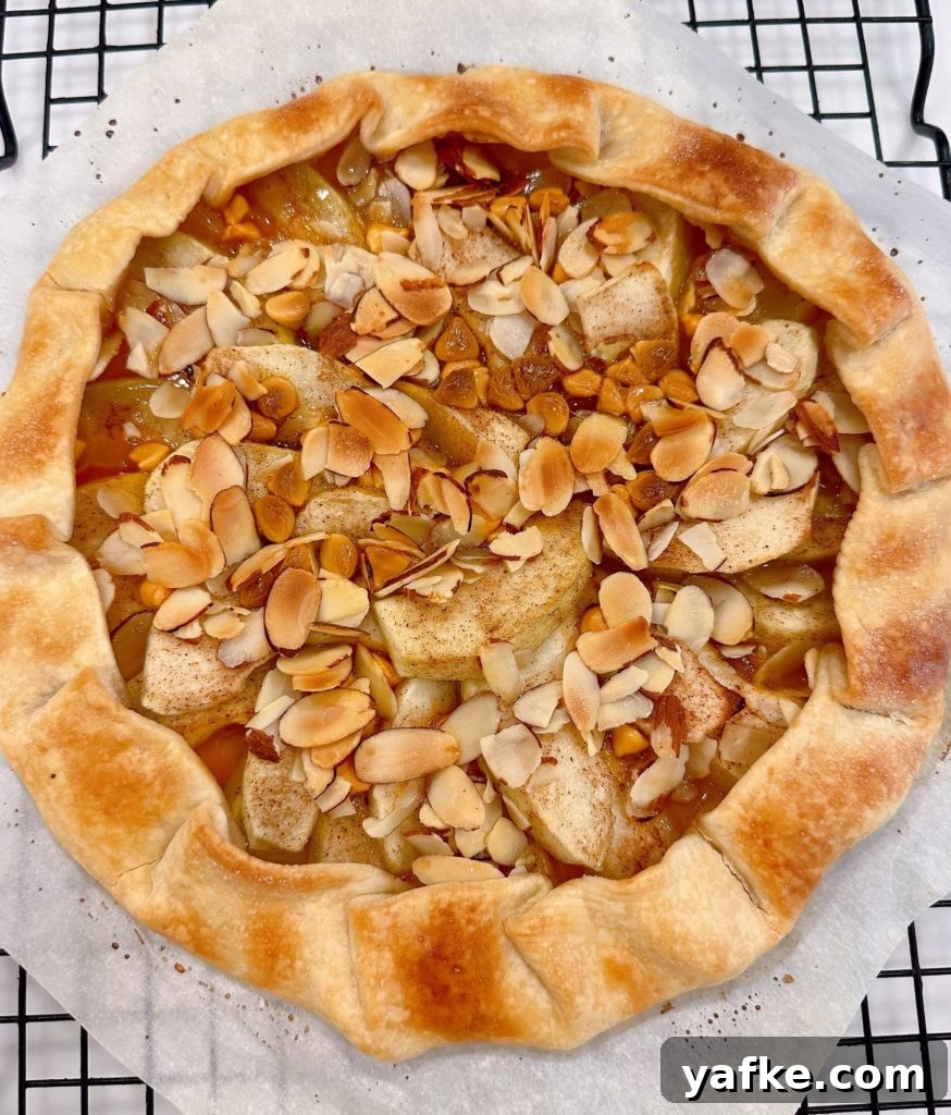 Rustic Apple Almond Galette Recipe with Flaky Crust 12 Baked galette on a cooling rack.