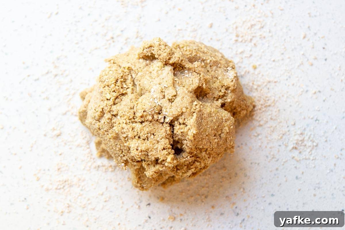 Homemade Pineapple Dog Treats Your Pup Will Love 4 A dough ball on a white countertop.