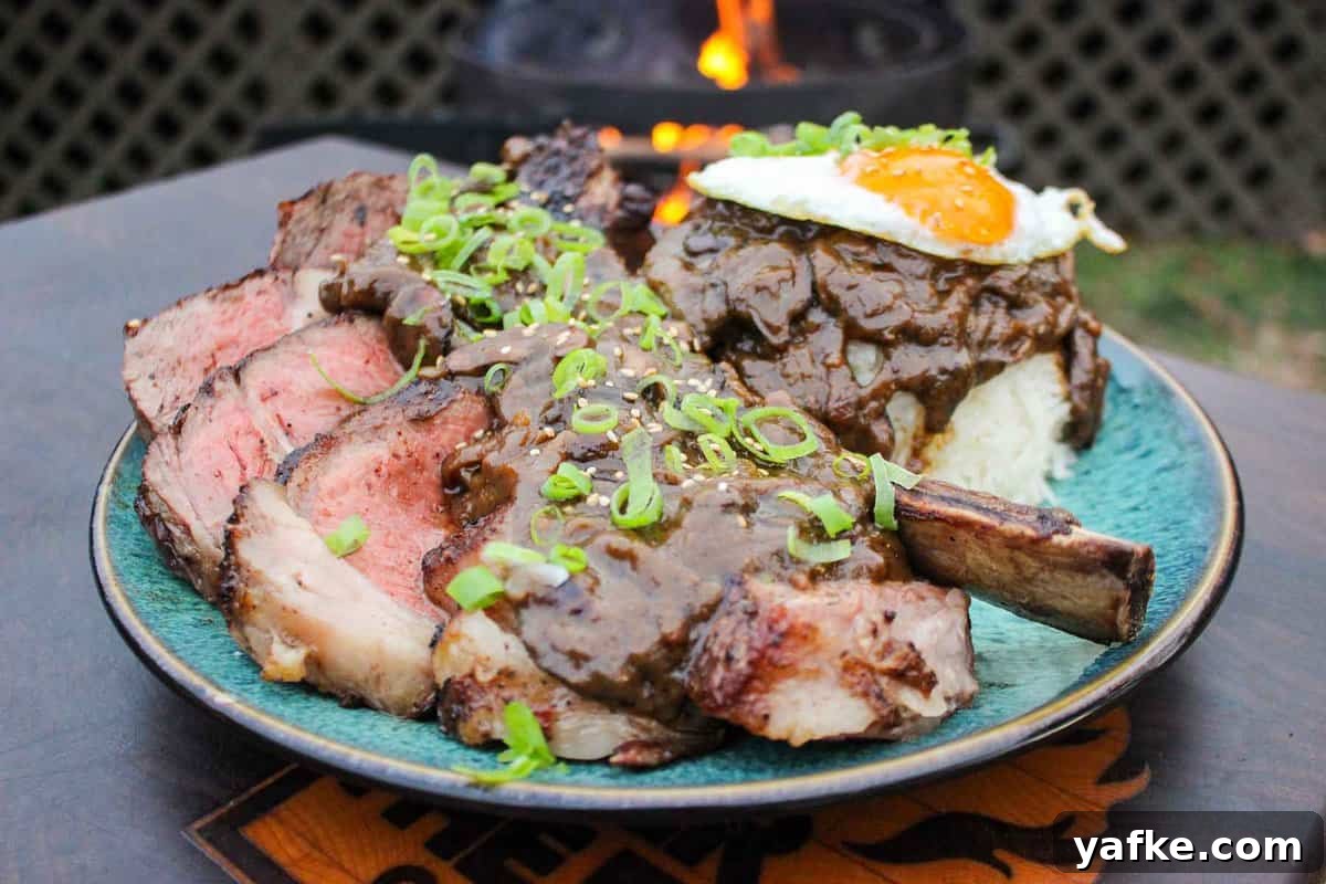 Steak Loco Moco Recipe: Hawaiian Beef Bowl with Gravy and Egg 2 A plate of Steak Moco Loco with mushroom gravy, rice, and a fried egg.