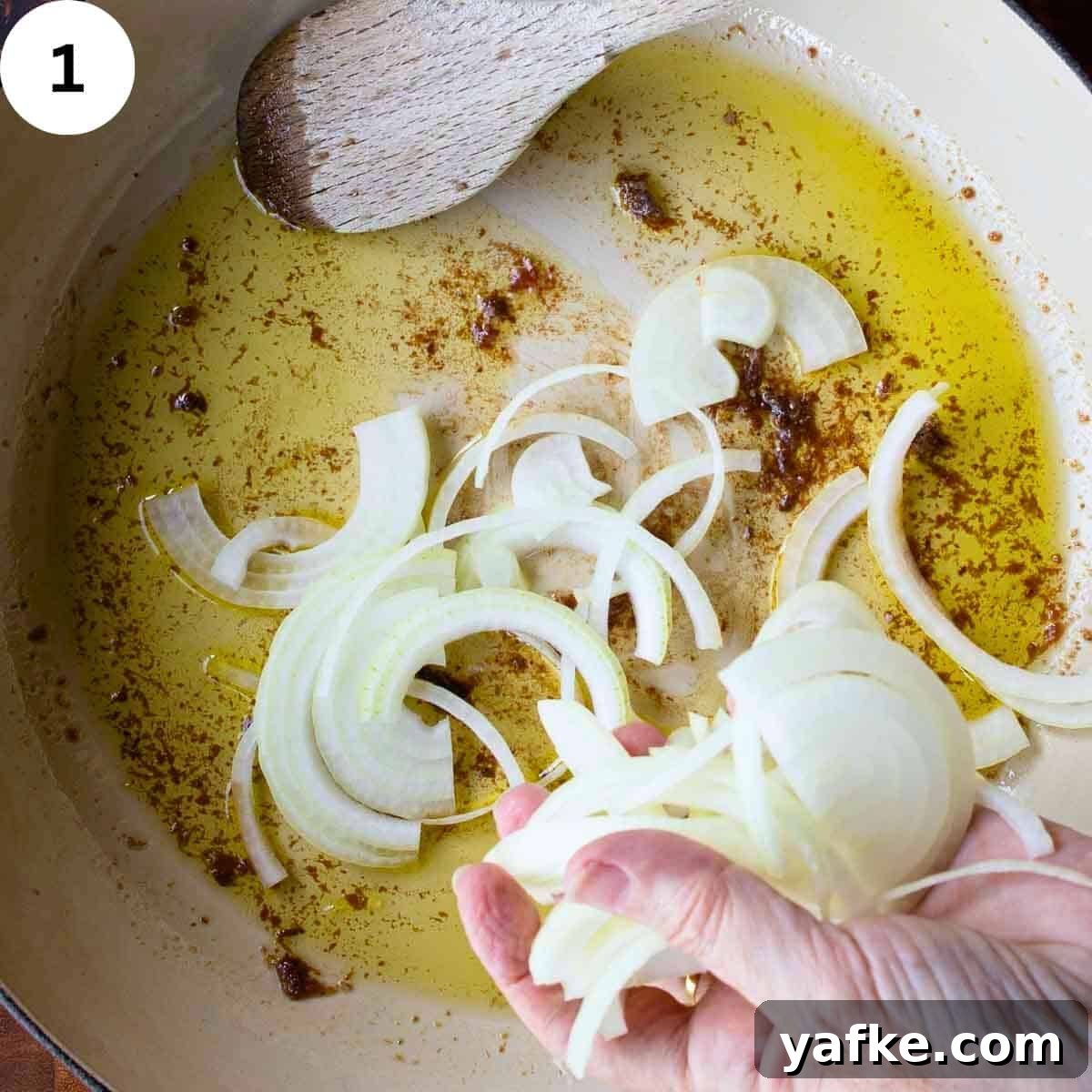 Creamy Tuna Pasta Recipe with Lemon & Capers 4 Sliced onions being added to a skillet.