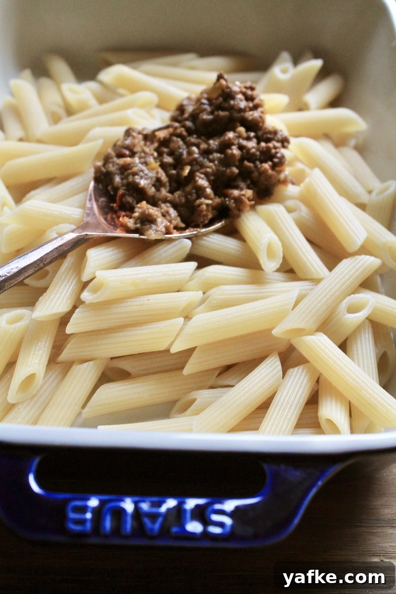 Cheesy Leftover Taco Meat Pasta Casserole 4 spread leftover taco meat over half cooked pasta
