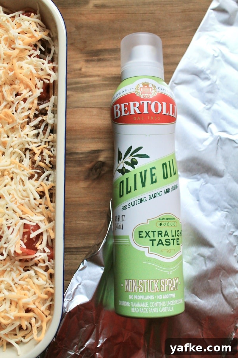 Cheesy Leftover Taco Meat Pasta Casserole 8 spray foil sheet with non stick cooking spray