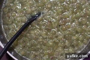 A pot of grape pulp simmering.