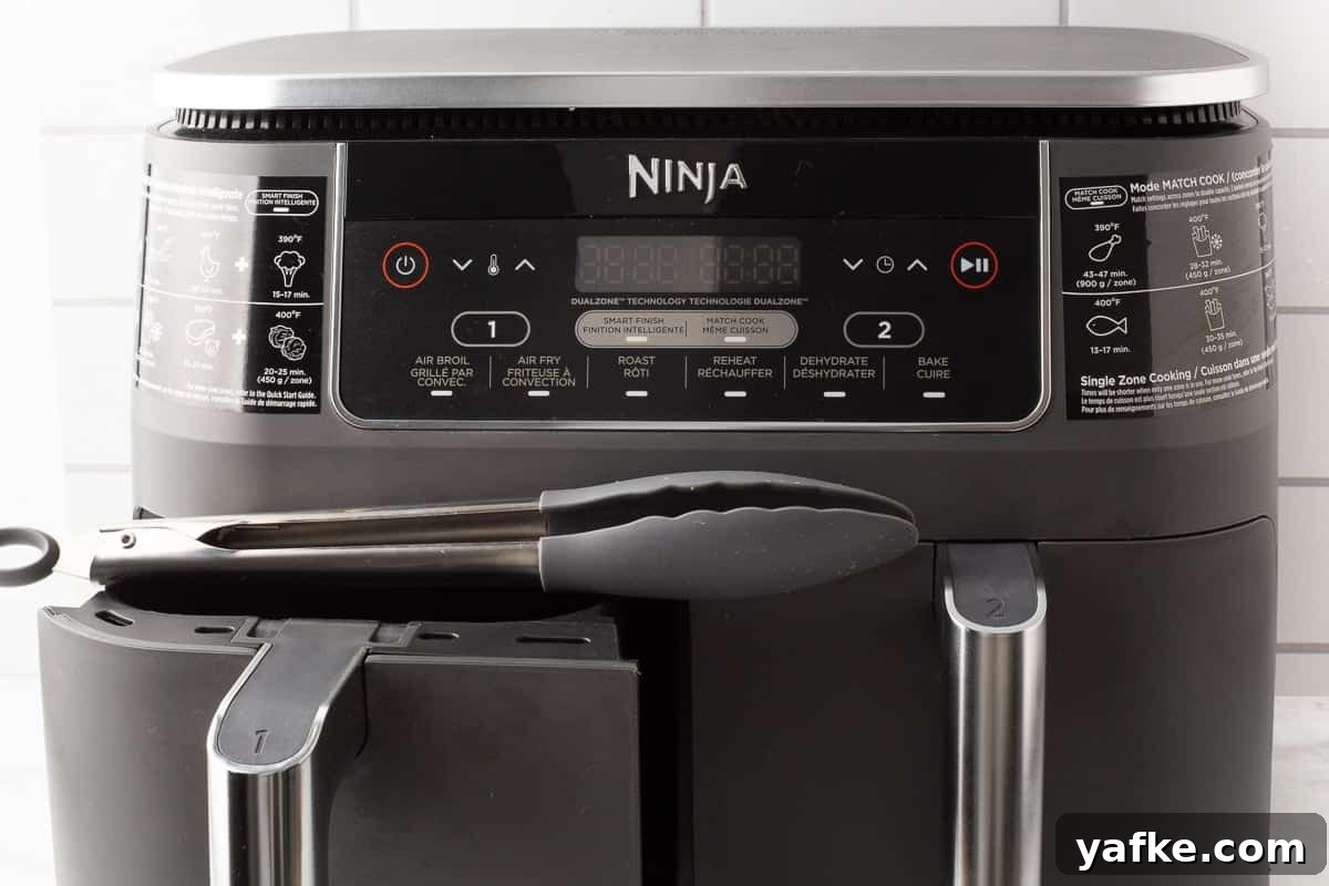 Crispy Air Fryer Tater Tots from Frozen 2 Ninja dual zone air fryer sitting on the counter.