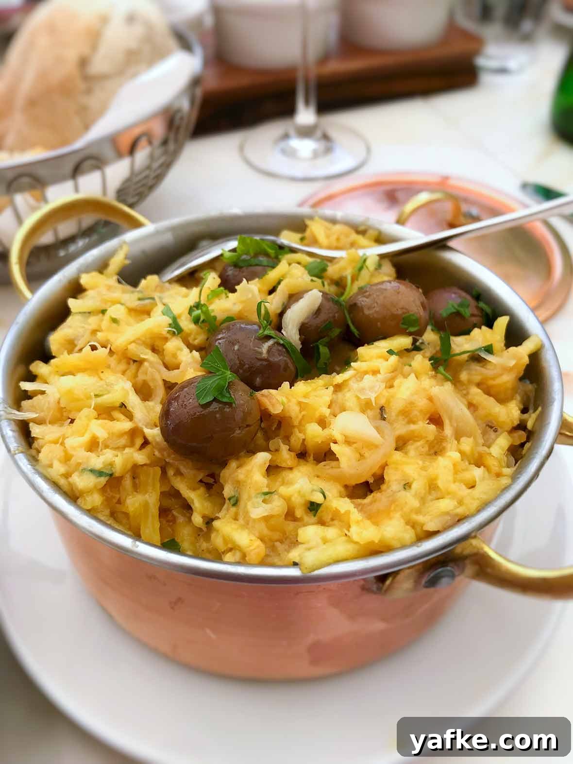 How to Buy, Soak and Cook Salt Cod (Bacalao) 4 A copper pot of bacalhau a Bras--or Portuguese scrambled eggs, salt cod, potatoes, onions, olives, and parsley.