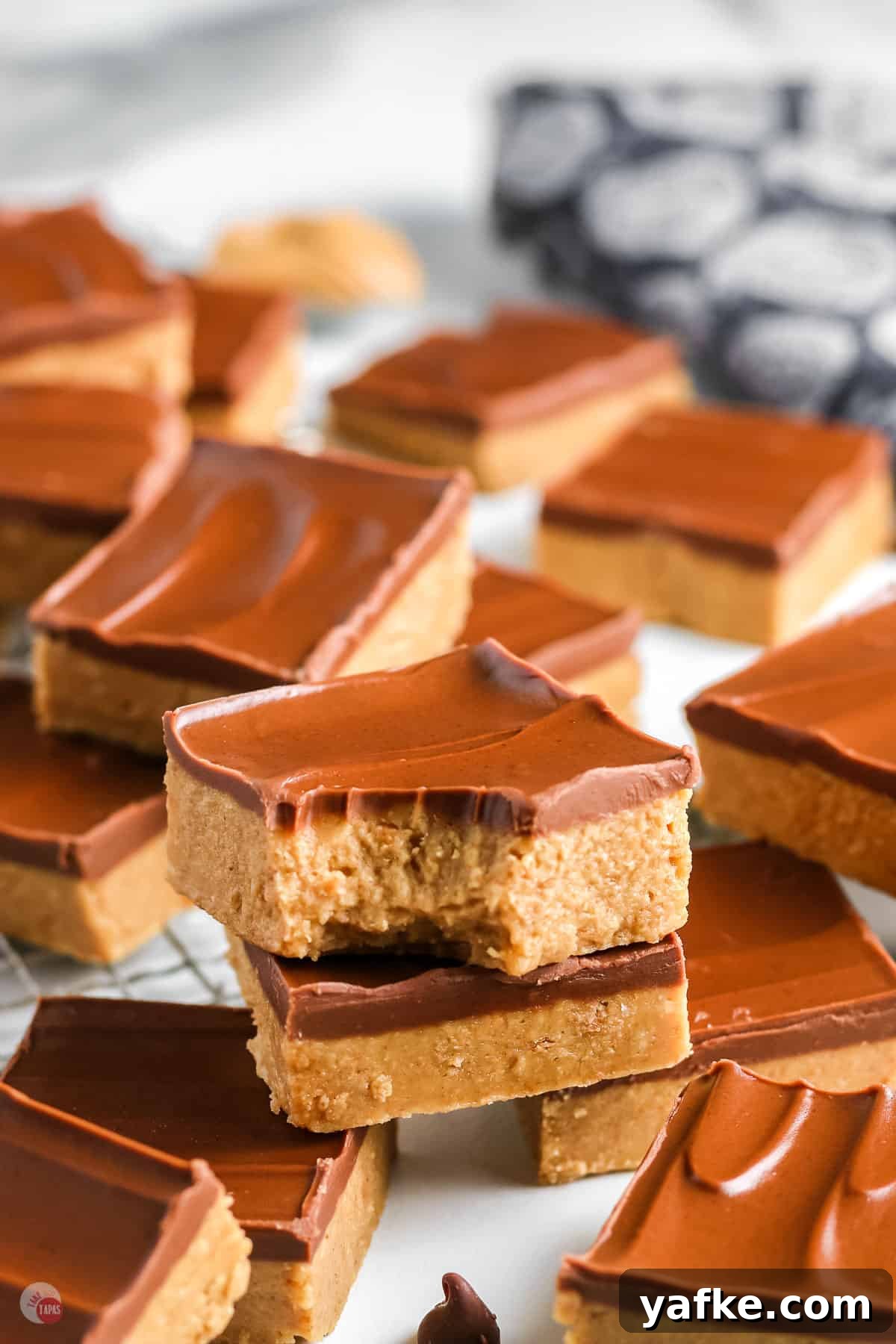 No-Bake Peanut Butter Bars Recipe 2 two peanut butter bars stacked on a tray of them