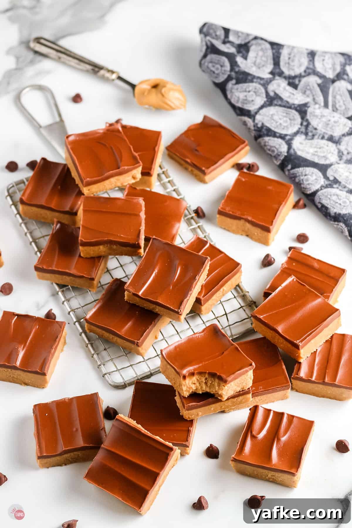 No-Bake Peanut Butter Bars Recipe 9 no bake peanut bars with a blue napkin