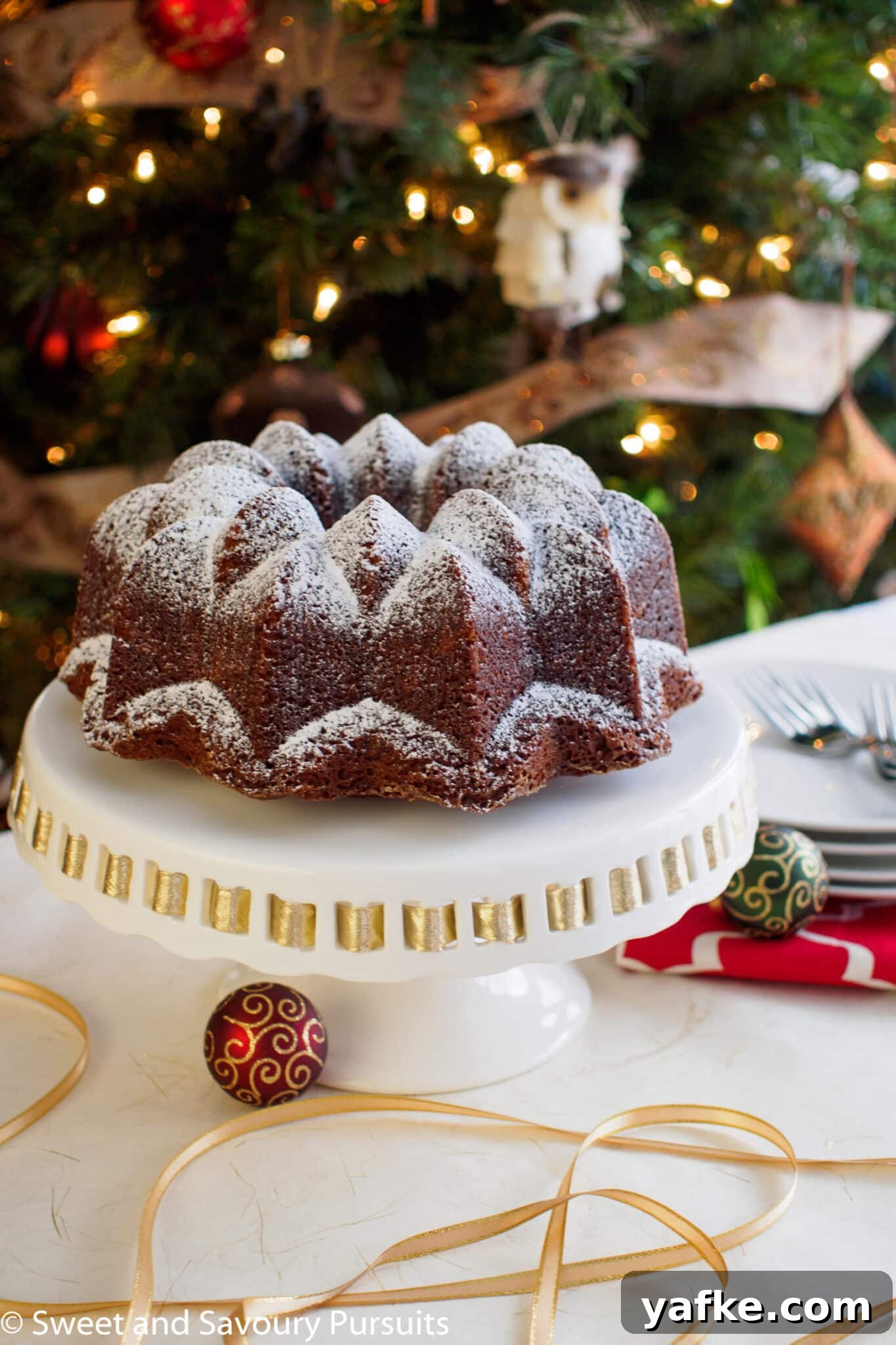 Gingerbread Bundt Cake with Warm Spiced Glaze 2 Espresso Gingerbread Bundt Cake on cake stand.