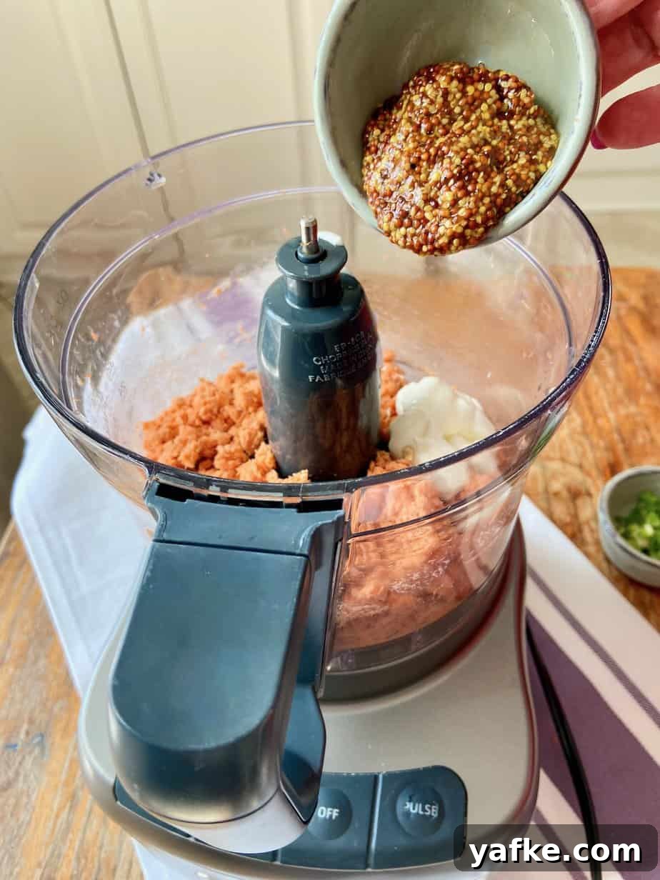 Smoked Salmon Spread with Cream Cheese, Dill and Lemon 5 Whole-grain mustard being added to food processor.