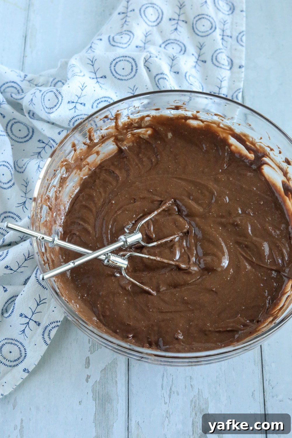 Decadent Chocolate Mound Cake Recipe 2 chocolate cake batter in a glass bowl.
