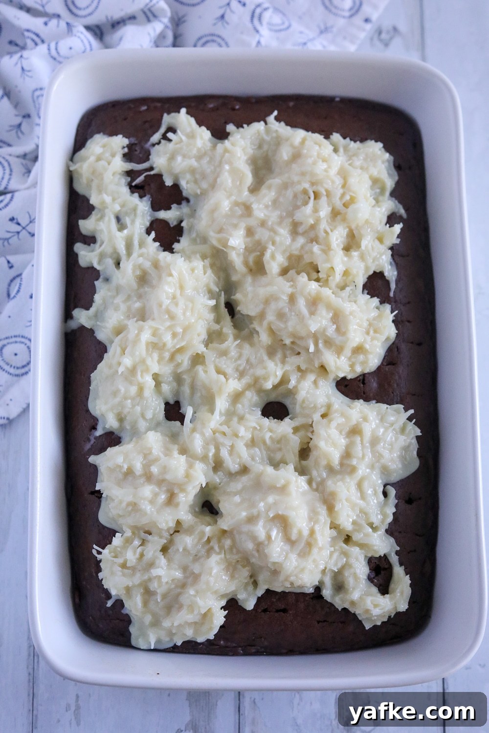 Decadent Chocolate Mound Cake Recipe 4 The coconut mixture spooned on top of the chocolate cake.