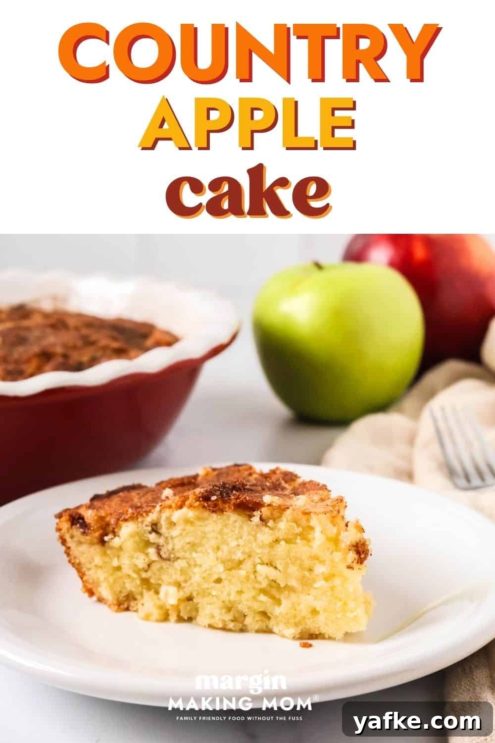 Rustic Apple Cake Recipe 2 Slice of easy country apple cake served on a white plate. The cake pan and fresh apples are in the background.