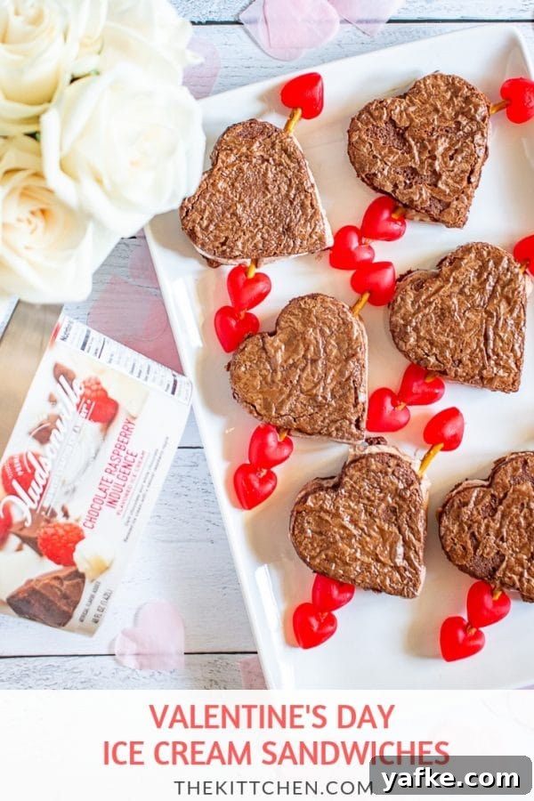 Valentine’s Day Ice Cream Sandwiches | These ice cream sandwiches made with Hudsonville’s Chocolate Raspberry Indulgence Ice Cream and boxed brownie mix are a perfect Valentine’s Day Dessert. #HudsonvilleHappy # HudsonvilleIceCream #ad Valentine’s Day Ice Cream Sandwiches | These ice cream sandwiches made with Hudsonville’s Chocolate Raspberry Indulgence Ice Cream and boxed brownie mix are a perfect Valentine’s Day Dessert. #HudsonvilleHappy # HudsonvilleIceCream #ad