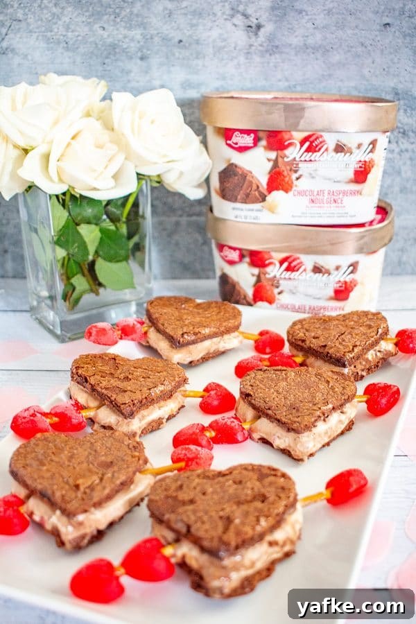 Valentine’s Day Ice Cream Sandwiches | These ice cream sandwiches made with Hudsonville Ice Cream and boxed brownie mix are a perfect Valentine’s Day Dessert. Valentine’s Day Ice Cream Sandwiches | These ice cream sandwiches made with Hudsonville Ice Cream and boxed brownie mix are a perfect Valentine’s Day Dessert.