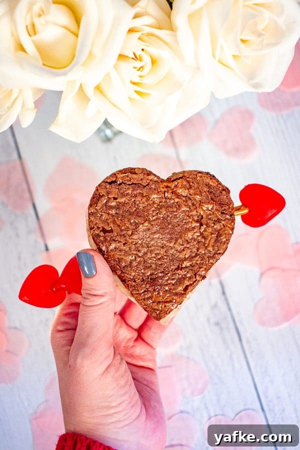 Valentine’s Day Ice Cream Sandwiches | These ice cream sandwiches made with Hudsonville Ice Cream and boxed brownie mix are a perfect Valentine’s Day Dessert. Valentine’s Day Ice Cream Sandwiches | These ice cream sandwiches made with Hudsonville Ice Cream and boxed brownie mix are a perfect Valentine’s Day Dessert.