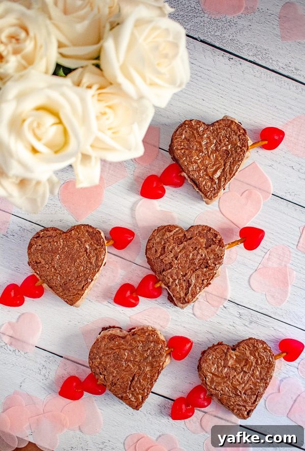 Valentine’s Day Ice Cream Sandwiches | These ice cream sandwiches made with Hudsonville Ice Cream and boxed brownie mix are a perfect Valentine’s Day Dessert. Valentine’s Day Ice Cream Sandwiches | These ice cream sandwiches made with Hudsonville Ice Cream and boxed brownie mix are a perfect Valentine’s Day Dessert.