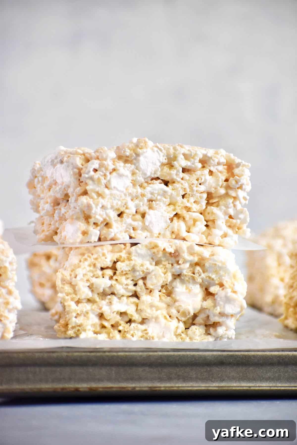 Rice Krispie Treats with Marshmallow Fluff 2 two rice krispie treats stacked on each other.