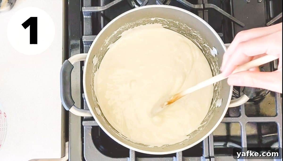 Rice Krispie Treats with Marshmallow Fluff 4 hand stirring pot of melted butter and marshmallows.