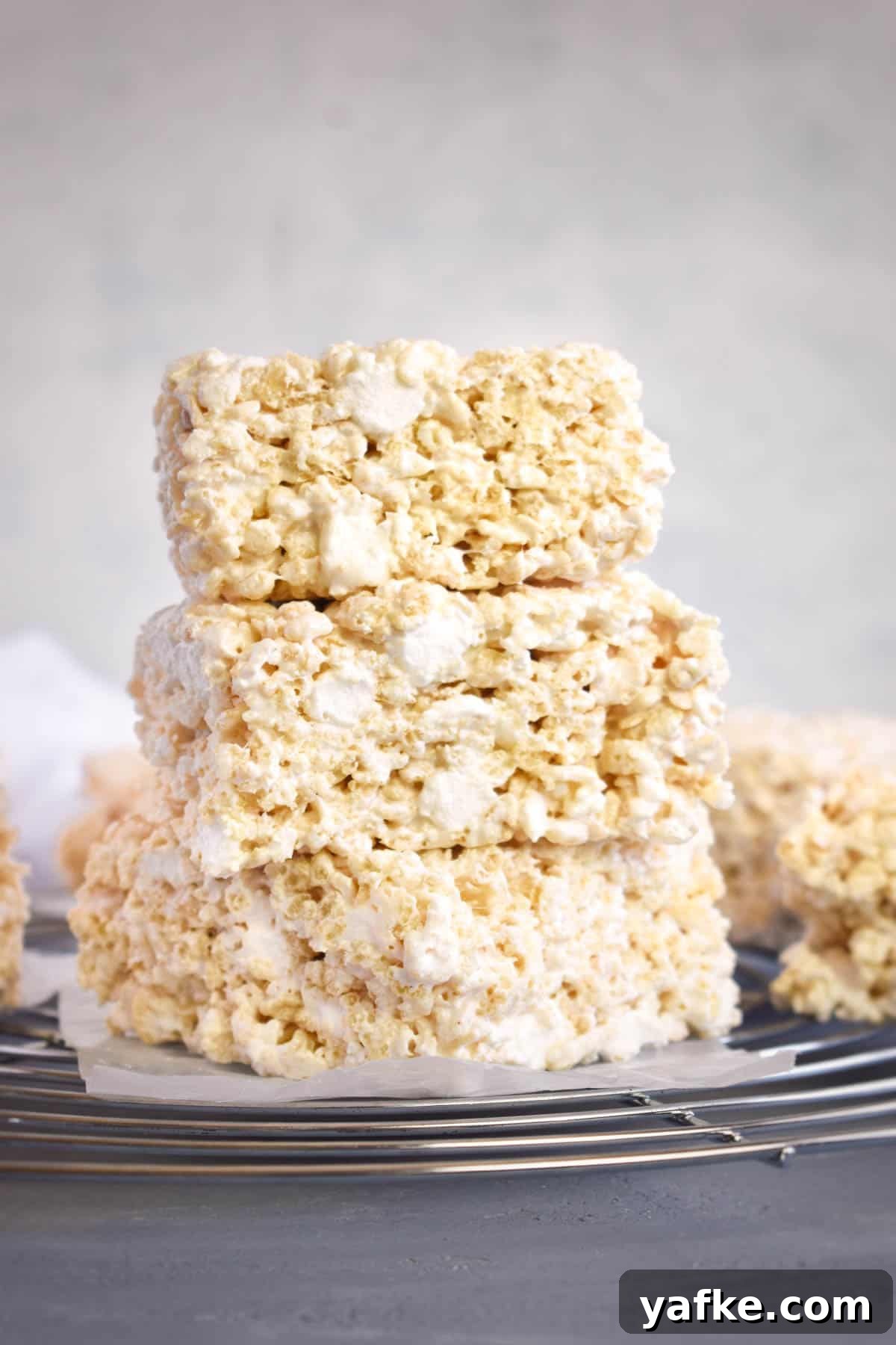 Rice Krispie Treats with Marshmallow Fluff 9 three rice krispie treats stack on top of each other.