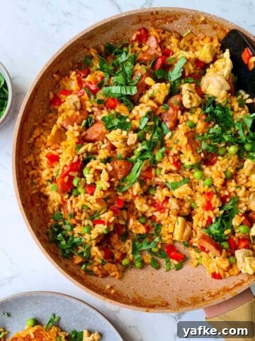 A pan of chicken paella ready for serve