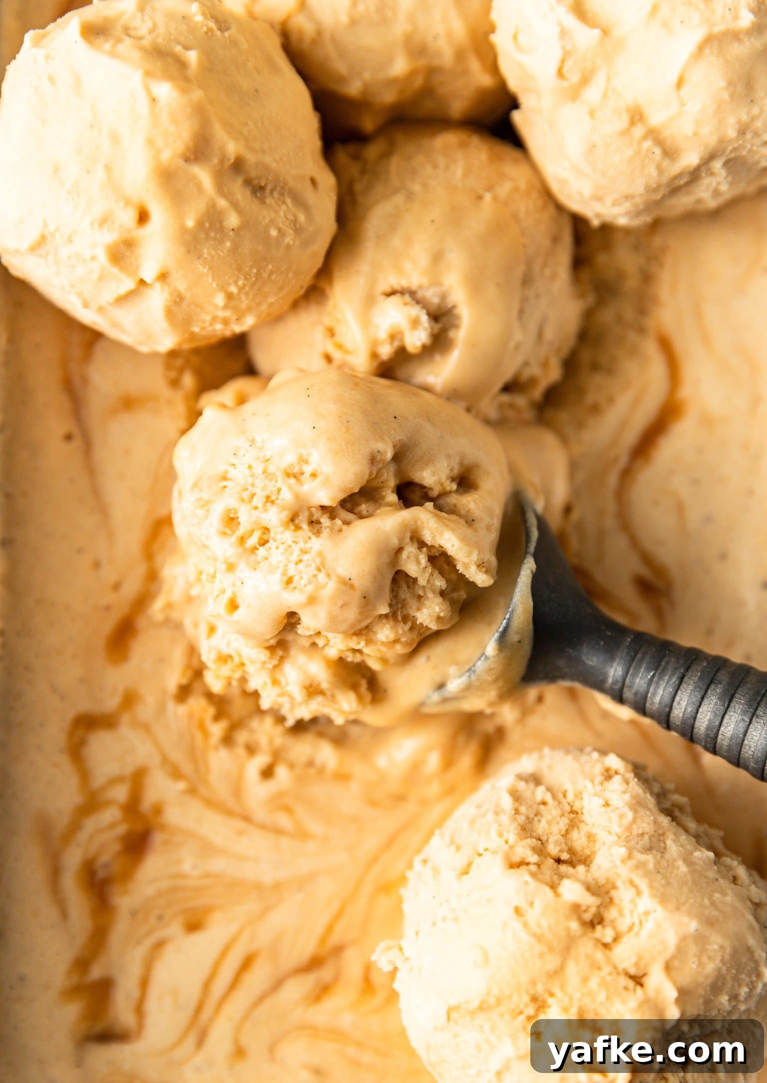 How to Make No Churn Bourbon Salted Caramel Ice Cream 4 Close up of scoops of no-churn bourbon salted caramel ice cream.